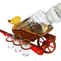 A decanter of a wheelbarrow with glasses - a gift, a manufacturer of gifts